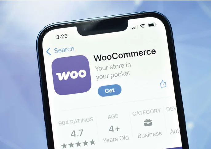 A phone showing the WooCommerce app listing in the App Store